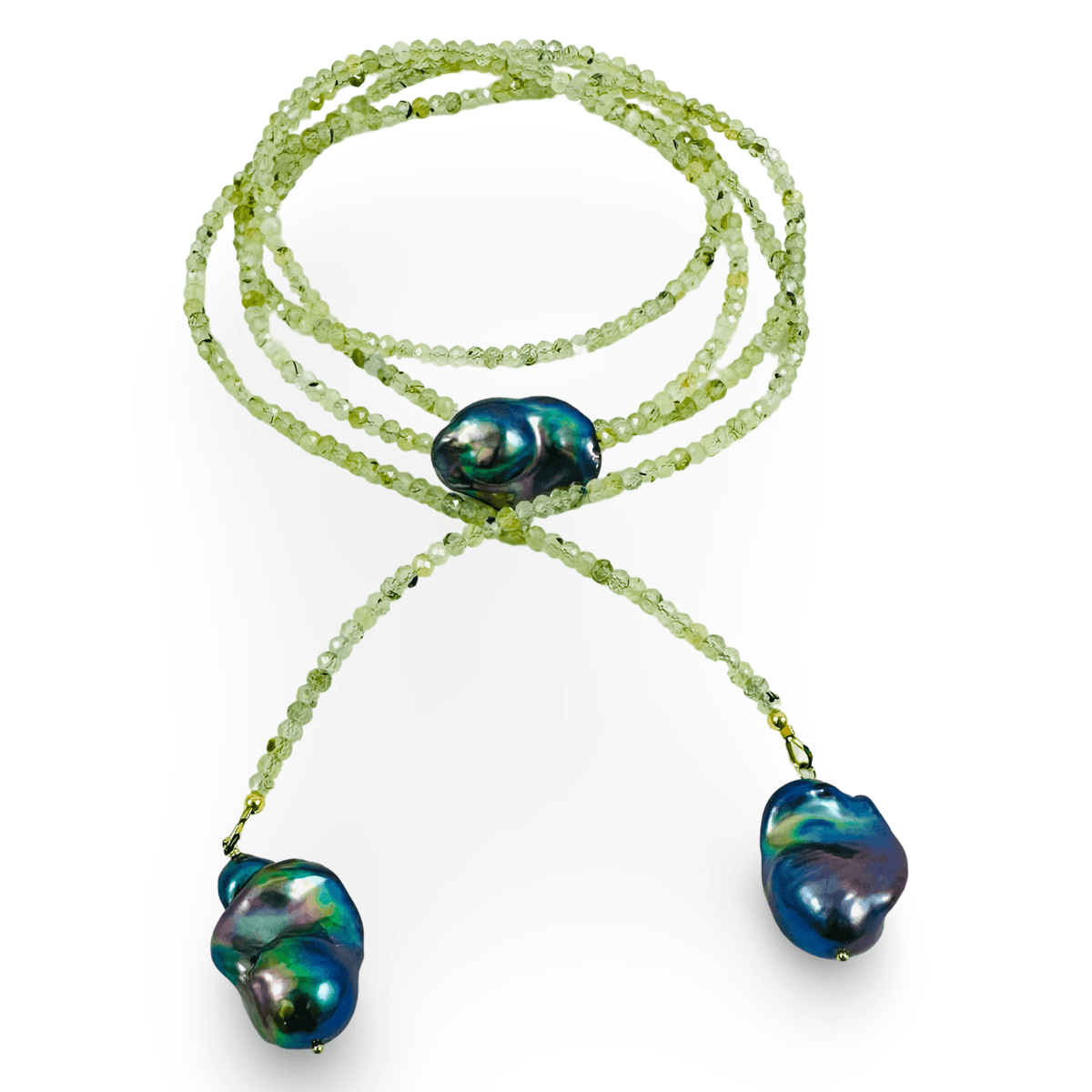 A long-strand beaded necklace featuring light green faceted beads and three baroque freshwater pearls with iridescent blue, green, and purple tones, displayed on a clean white background.