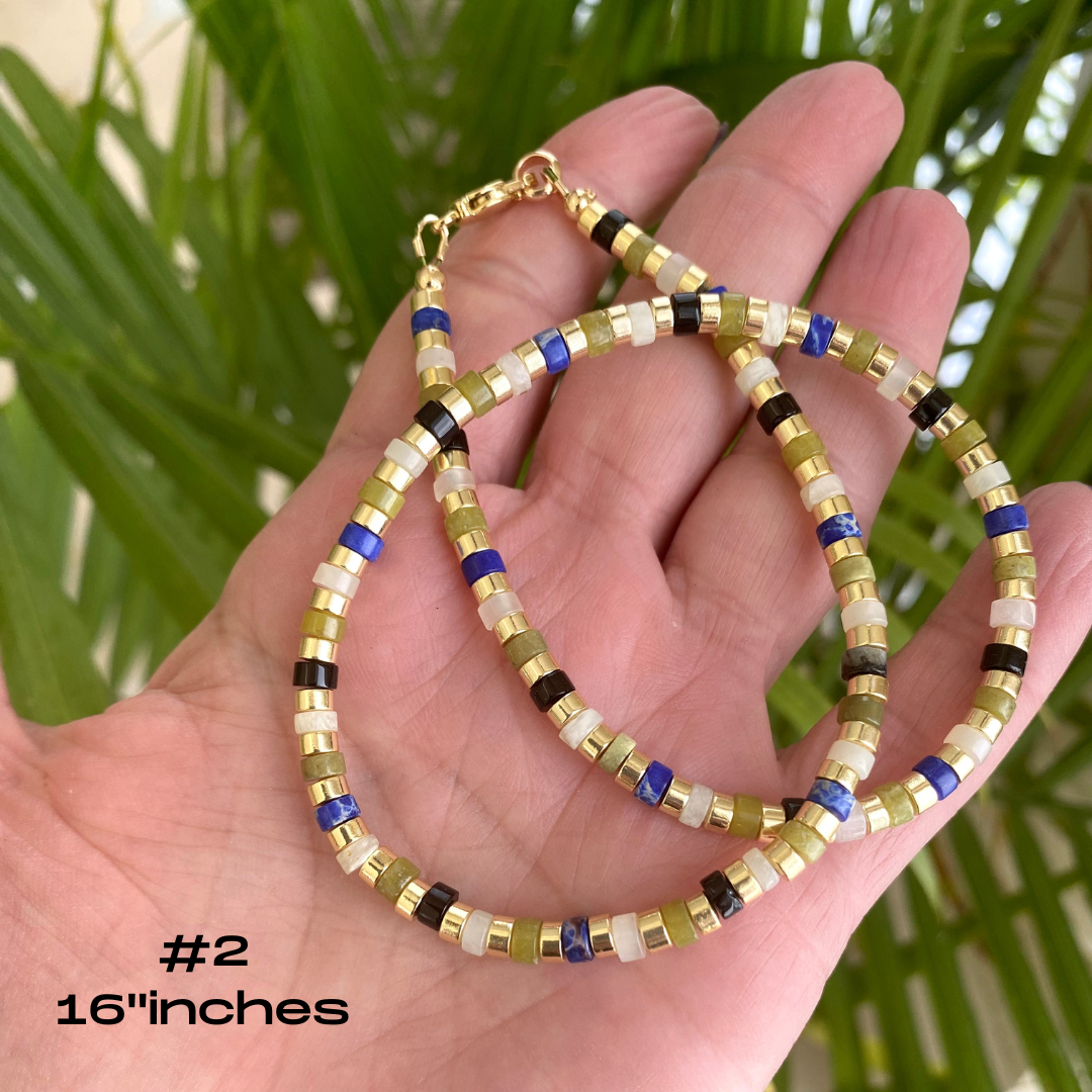 Gemstone choker necklace featuring multi-color beads and hematite, perfect for everyday style. Length: 16 inches.
