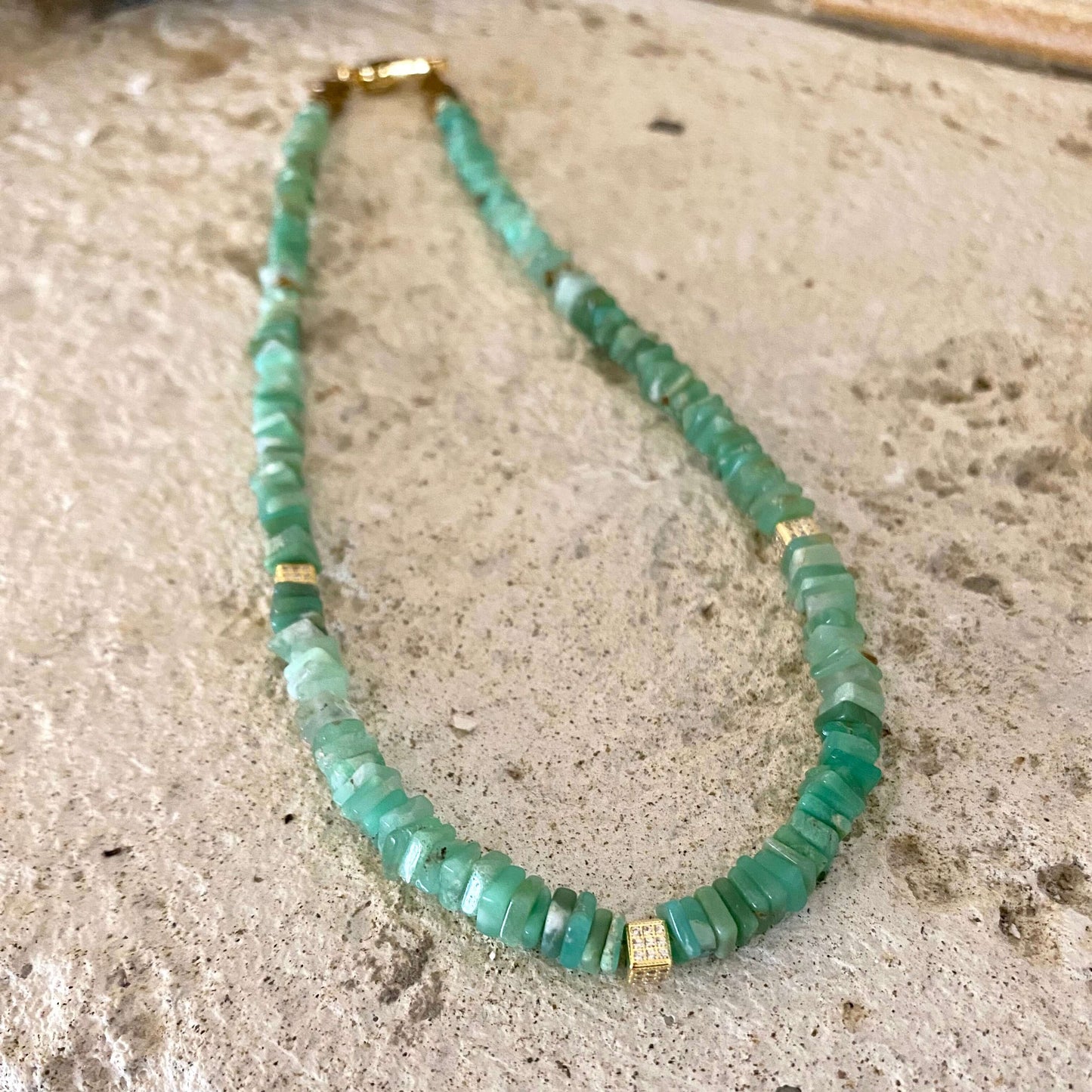 Chrysoprase choker necklace with green heishi beads showcasing vibrant geometric stones and golden accents.