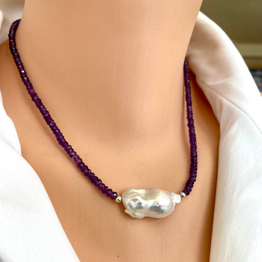 Amethyst baroque pearl necklace worn on neckline with large white baroque pearl centerpiece