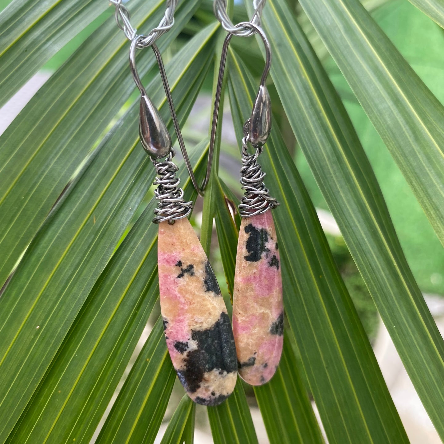 Rhodonite Teardrop Earrings – Black Rhodium Finish featuring unique pink and black veined gemstones.