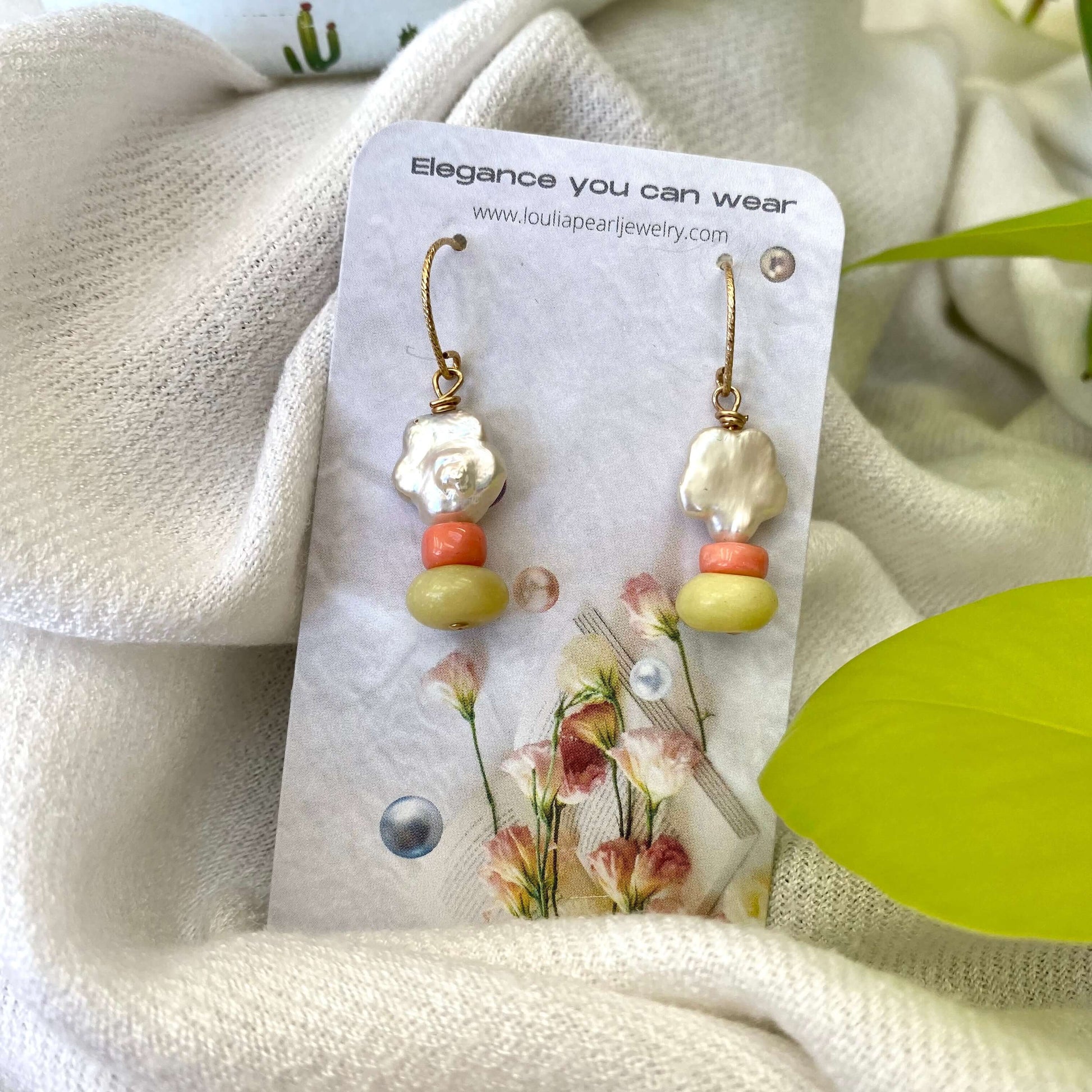 Dainty pearl drop earrings with floral baroque design featuring quartz and coral accents.