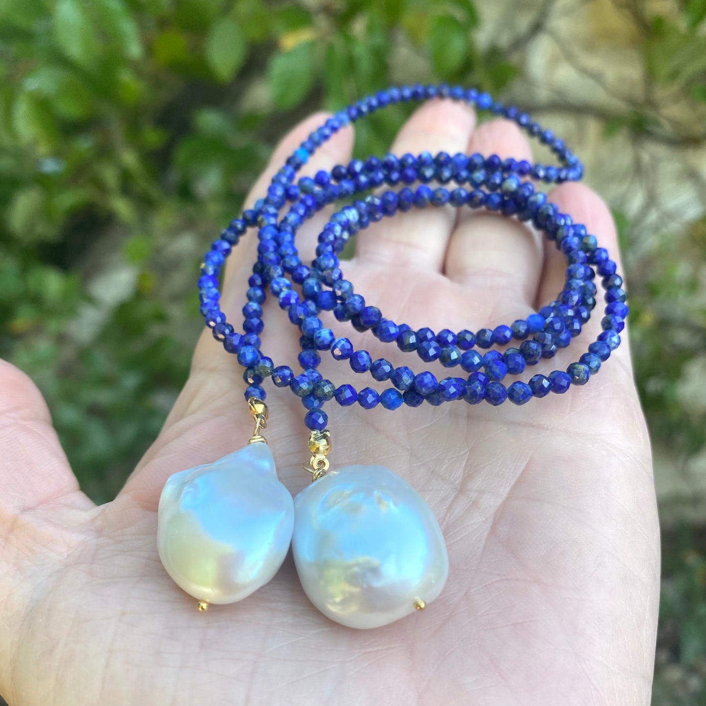 Lapis lazuli baroque pearl lariat necklace showing blue gemstone beads and white pearls