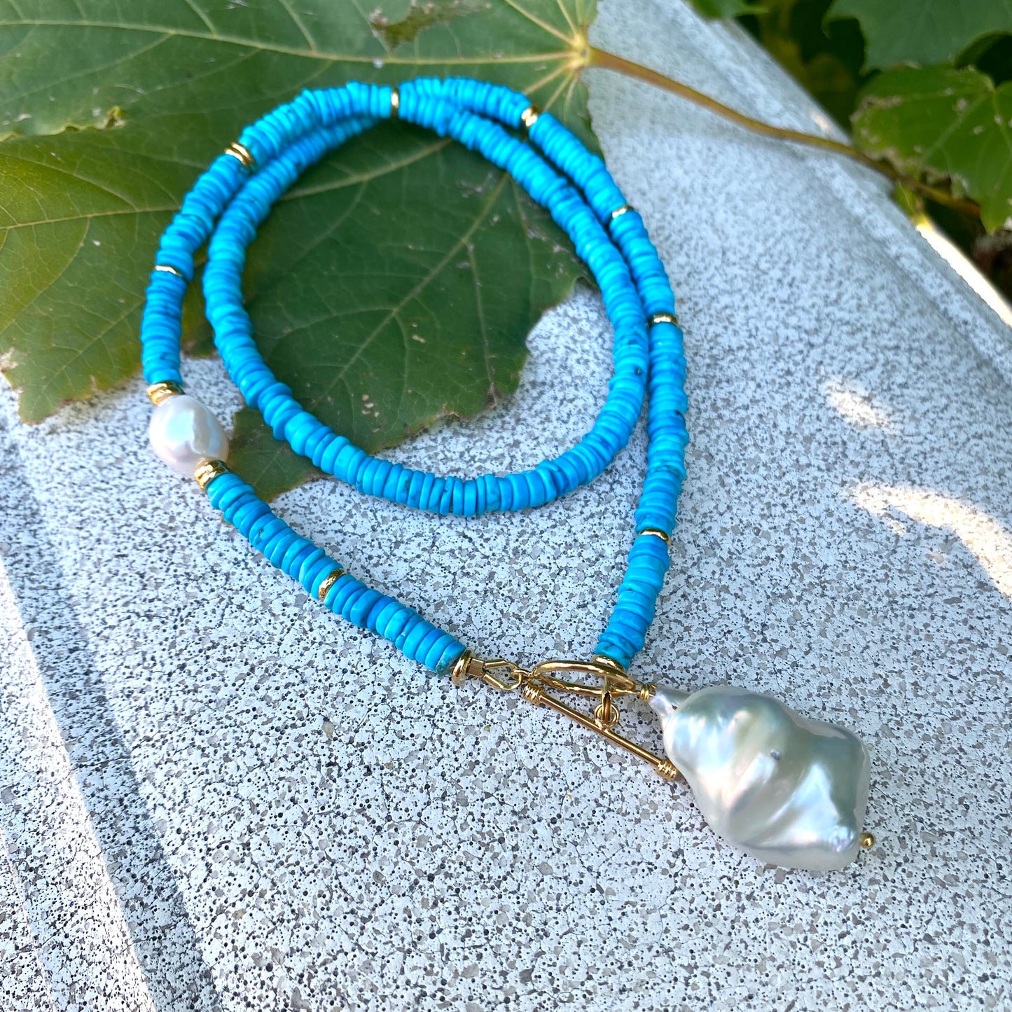 Turquoise Pearl Toggle Necklace with vibrant turquoise tire beads and baroque pearls, showcasing elegant handmade jewelry.