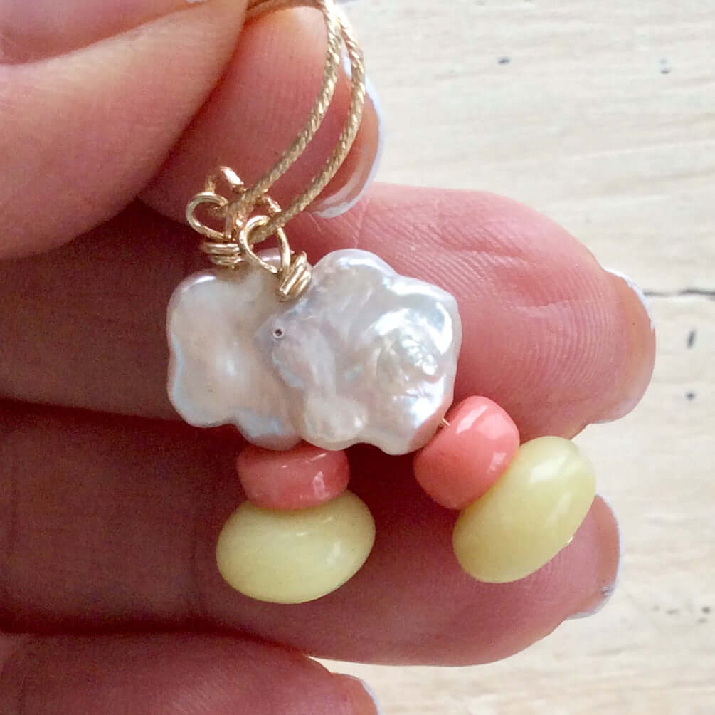 Dainty pearl drop earrings featuring floral baroque design with pink coral and green quartz accents.