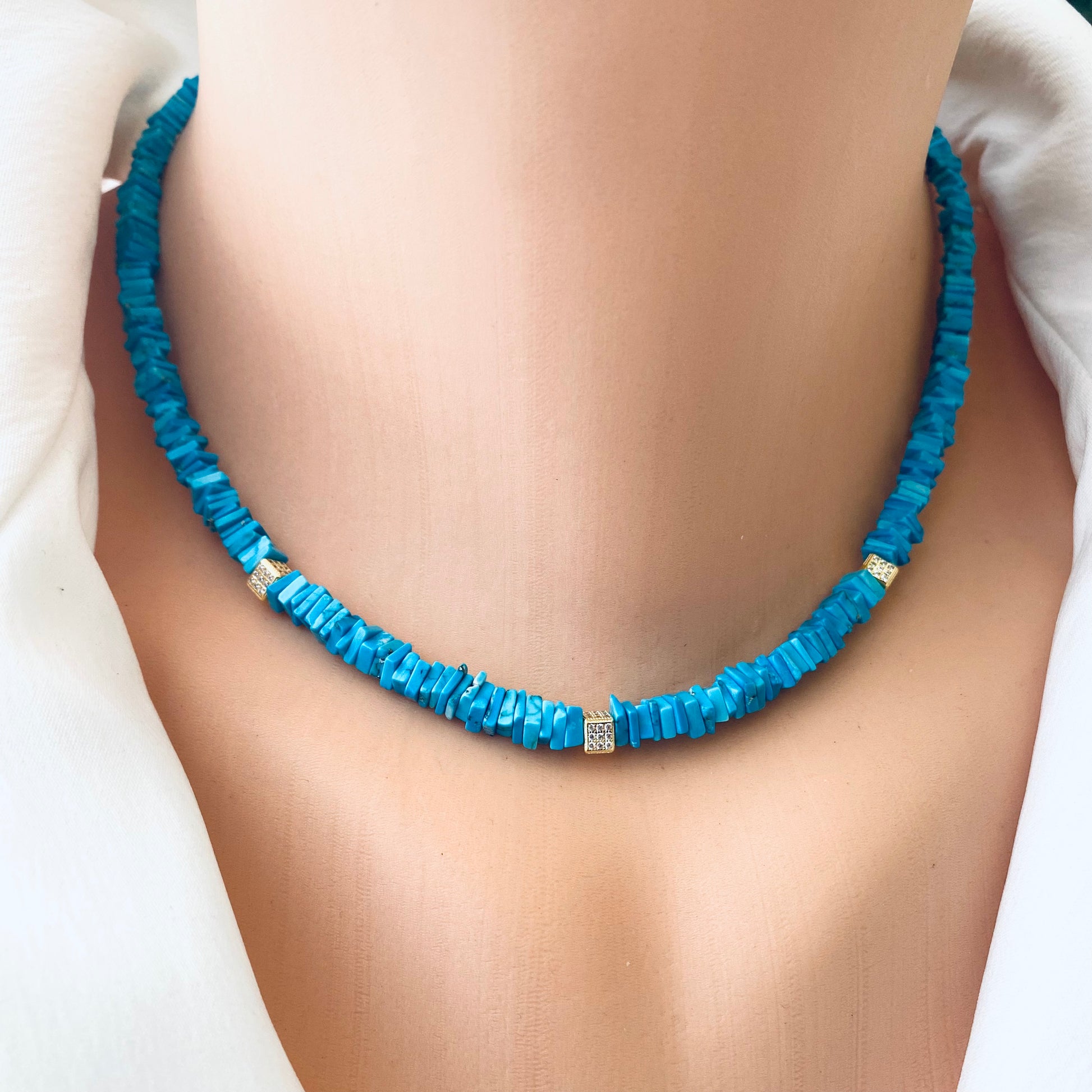 Turquoise choker necklace with natural turquoise beads displayed on a mannequin, showcasing vibrant color and elegance.