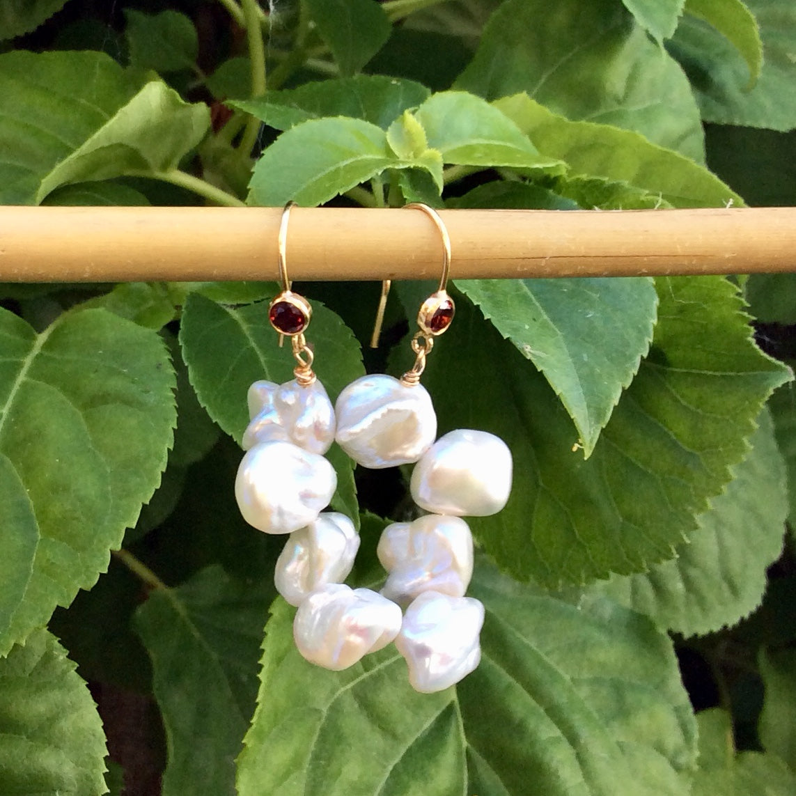 Pearl drop earrings with keshi pearls and red CZ, handmade in Canada, showcasing unique shapes and natural shine.