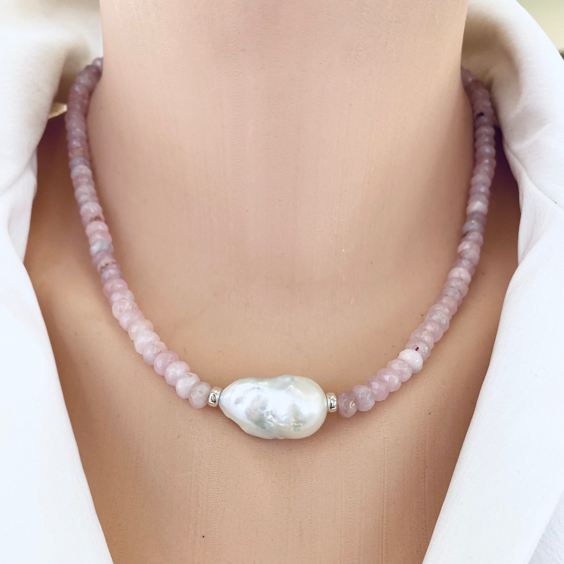 Rose quartz pearl necklace worn on neckline highlighting soft pink gemstone beads and baroque pearl, handmade in Canada