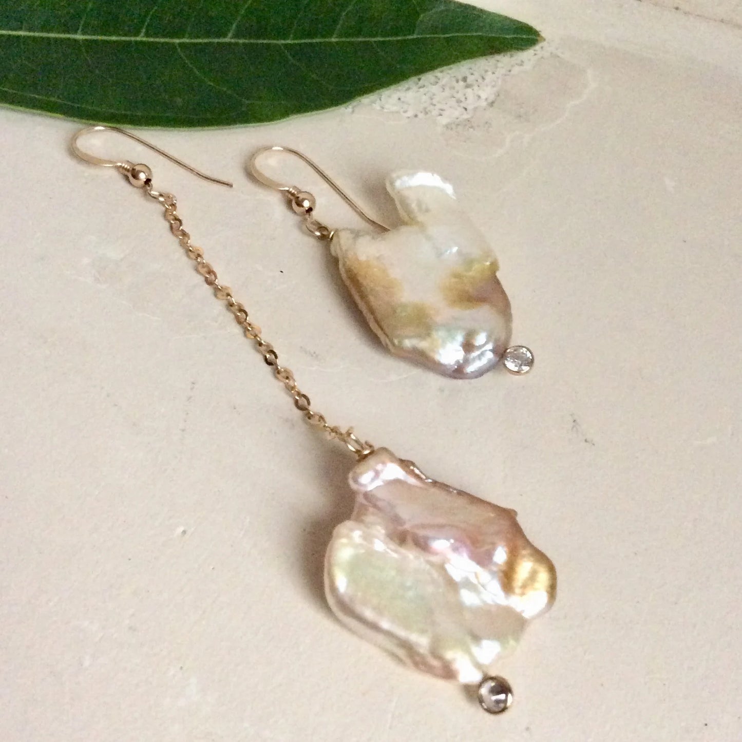 Mismatched Pearl Drop Earrings featuring unique asymmetrical designs and clear CZ accents, handcrafted with 14k gold filled.
